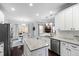 Spacious kitchen showcasing a large island, stainless steel appliances, and a breakfast nook at 222 Friesan Way, Rolesville, NC 27571