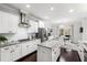 Open concept kitchen with stainless steel appliances, granite counters, and adjacent dining area at 222 Friesan Way, Rolesville, NC 27571