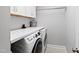 Functional laundry room with side-by-side washer and dryer and white countertop at 222 Friesan Way, Rolesville, NC 27571