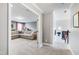 Upstairs hallway leading to a living room with a sectional sofa at 222 Friesan Way, Rolesville, NC 27571