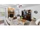 Spacious living room with a stone fireplace, ceiling fan and hardwood flooring at 222 Friesan Way, Rolesville, NC 27571