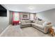 Cozy living room features neutral walls, plush carpet, and a comfortable sectional sofa at 222 Friesan Way, Rolesville, NC 27571