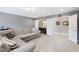 Bright living room with comfortable sofa, neutral paint, recessed lights, and bar area at 222 Friesan Way, Rolesville, NC 27571