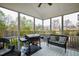 Inviting screened porch featuring a grill and comfortable seating at 222 Friesan Way, Rolesville, NC 27571