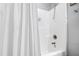 Clean shower with a white shower curtain and chrome fixtures at 222 Friesan Way, Rolesville, NC 27571