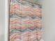 Close-up of a shower with a decorative, horizontally striped shower curtain at 222 Friesan Way, Rolesville, NC 27571