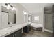 Bathroom featuring dual sinks, a tub, and a separate shower at 248 Dutches Ln, Henderson, NC 27537