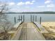 Lakefront boat ramp with concrete drive and two docks for easy water access to the lake beyond at 248 Dutches Ln, Henderson, NC 27537