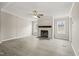 Spacious living room with fireplace, ceiling fan and luxury vinyl flooring at 248 Dutches Ln, Henderson, NC 27537