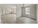 Open living space with luxury vinyl floors connecting the living and dining areas at 248 Dutches Ln, Henderson, NC 27537