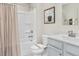 Well-lit bathroom featuring a bathtub-shower combo, neutral walls, and modern fixtures at 26 Artesa Ct, Fuquay Varina, NC 27526