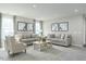 Spacious living room with neutral decor, plush carpeting, comfortable seating, and decorative artwork at 26 Artesa Ct, Fuquay Varina, NC 27526