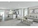 Open floor plan with a seamless flow from the modern kitchen to the cozy and inviting living room area at 26 Artesa Ct, Fuquay Varina, NC 27526