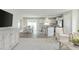 Inviting open-concept living space features a modern kitchen, dining area, and a seamlessly connected living room at 26 Artesa Ct, Fuquay Varina, NC 27526