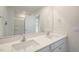 Bathroom features a double sink vanity with white cabinets and a large mirror at 267 Palm Dr, Sanford, NC 27332