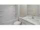 Bright, clean bathroom featuring a white vanity, tub-shower combo, and modern fixtures at 267 Palm Dr, Sanford, NC 27332