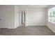 Bedroom features vinyl flooring and a sunny window with a view to the outside at 267 Palm Dr, Sanford, NC 27332