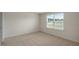 Bedroom featuring neutral carpet and a bright window at 267 Palm Dr, Sanford, NC 27332