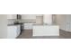 Modern kitchen features white cabinets, granite countertops and stainless steel appliances at 267 Palm Dr, Sanford, NC 27332
