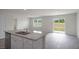 Kitchen with stainless appliances, granite countertops and a view to the backyard at 267 Palm Dr, Sanford, NC 27332