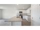 Bright kitchen with white cabinets, granite countertops, stainless steel appliances, and island at 267 Palm Dr, Sanford, NC 27332