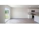 Spacious living room with access to the backyard and modern kitchen features at 267 Palm Dr, Sanford, NC 27332
