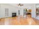 Spacious living room with a fireplace, hardwood floors, and an open view into the kitchen at 3 Rencher Ct, Durham, NC 27703