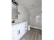 Bathroom featuring white cabinets with black hardware and walk-in shower at 307 7Th St, Butner, NC 27509