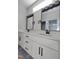 Bathroom featuring a double sink vanity with black hardware and lighting at 307 7Th St, Butner, NC 27509