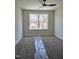 Empty carpeted bedroom with a window at 307 7Th St, Butner, NC 27509