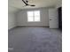 Spacious carpeted bedroom with ceiling fan and natural light at 307 7Th St, Butner, NC 27509