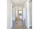 Hallway with hardwood floors that leads to multiple rooms and a living room at 307 7Th St, Butner, NC 27509