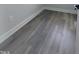 Hardwood floors in a hallway leading to multiple rooms and access to natural light at 307 7Th St, Butner, NC 27509