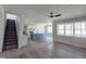 Open-concept living room featuring hardwood floors, a staircase, and lots of natural light at 307 7Th St, Butner, NC 27509