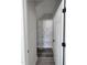 Walk-in pantry with wooden shelves and hardwood floors for plenty of storage space at 307 7Th St, Butner, NC 27509