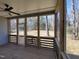 Screened-in porch with wood decking and scenic backyard views at 307 7Th St, Butner, NC 27509