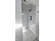 A tiled shower featuring black fixtures and a tiled shower floor at 307 7Th St, Butner, NC 27509