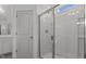 Bathroom with a walk-in shower and ample natural light at 336 Pecan Valley Way, Four Oaks, NC 27524