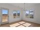 Bright dining area with hardwood floors and view to outdoors at 336 Pecan Valley Way, Four Oaks, NC 27524