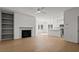 Open living space with fireplace, built in shelves, and access to the kitchen area at 336 Pecan Valley Way, Four Oaks, NC 27524