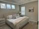 Comfortable main bedroom features large windows, neutral paint, and decorative pillows at 365 Rocky Crest Ln, Wake Forest, NC 27587