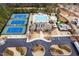 Aerial view of community featuring tennis courts, pool, and clubhouse with parking at 3659 Coach Lantern Ave, Wake Forest, NC 27587