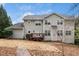 View of the backyard with a small back deck and two-story home at 3659 Coach Lantern Ave, Wake Forest, NC 27587