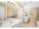 Bright bathroom features a double sink vanity, soaking tub and shower at 3659 Coach Lantern Ave, Wake Forest, NC 27587