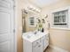 This bathroom features a single sink vanity with a large framed mirror at 3659 Coach Lantern Ave, Wake Forest, NC 27587