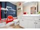 This bathroom features a car-themed shower curtain and white cabinets at 3659 Coach Lantern Ave, Wake Forest, NC 27587