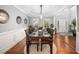 Formal dining room with a large table, elegant decor, and plenty of seating for entertaining at 3659 Coach Lantern Ave, Wake Forest, NC 27587