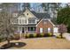 Beautiful two-story home with a covered porch, attached garage, and manicured landscaping at 3659 Coach Lantern Ave, Wake Forest, NC 27587