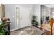 Bright foyer featuring hardwood floors, elegant decor, and a welcoming atmosphere at 3659 Coach Lantern Ave, Wake Forest, NC 27587