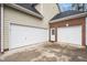 Attached garages offering ample parking and storage space, with neutral siding and roofing at 3659 Coach Lantern Ave, Wake Forest, NC 27587